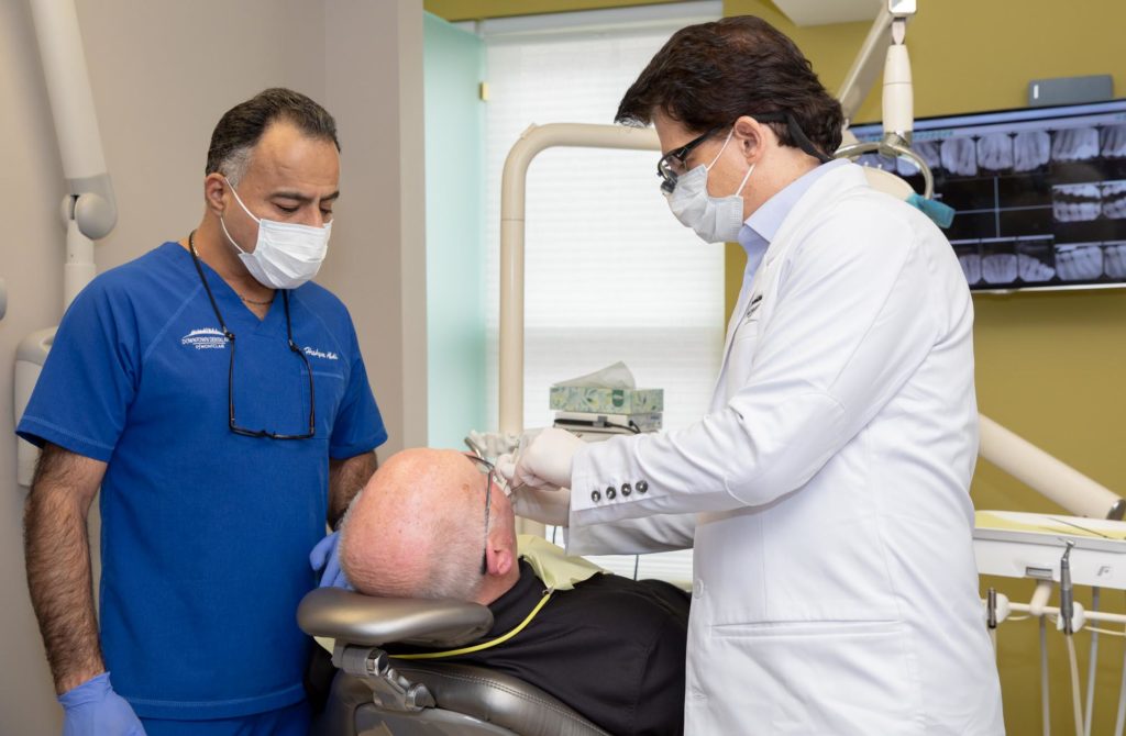 Dr. Trichas consulting a patient MONTCLAIR, NJ