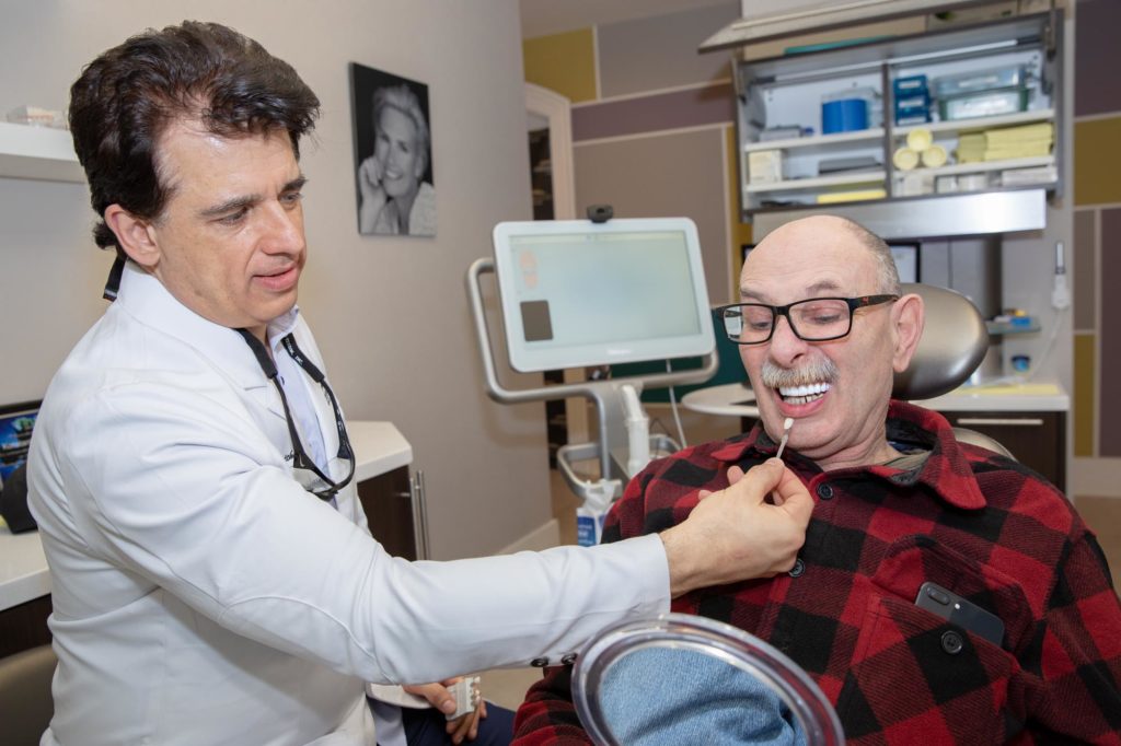 Dr Trichas consulting a patient MONTCLAIR, NJ